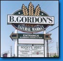 B. Gordons Natural Market advertising sign